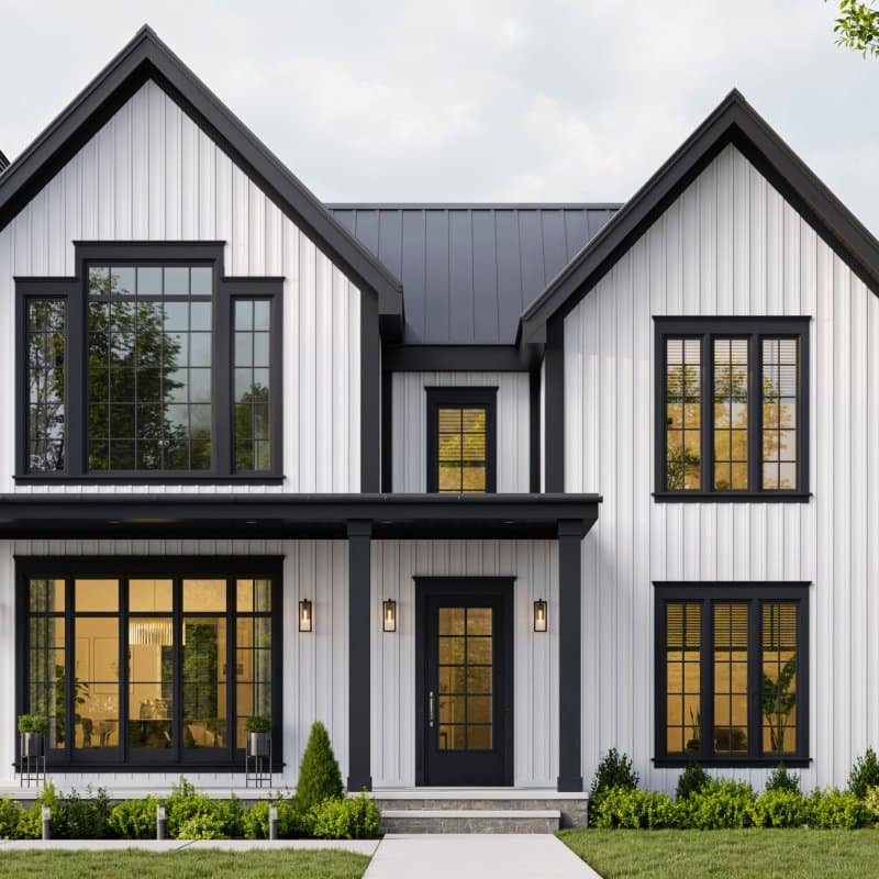 A white two-story modern farmhouse clad in composite board-and-batten siding with black-framed windows and a dark standing-seam roof