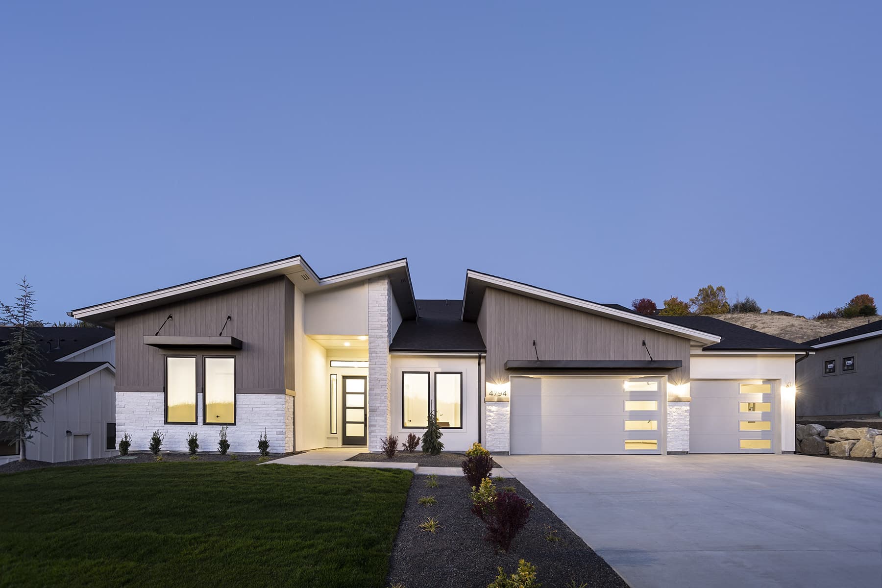 A coastal-gray home with seamless cellular-PVC cladding