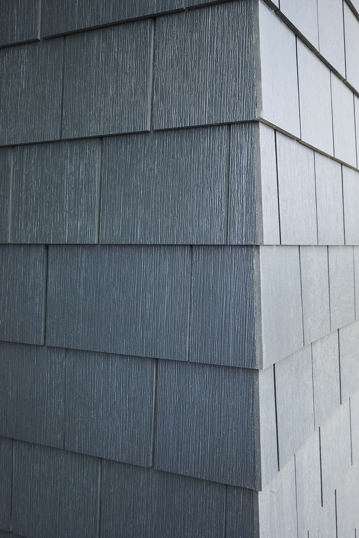 Straight shingle cellular-PVC siding on a home exterior