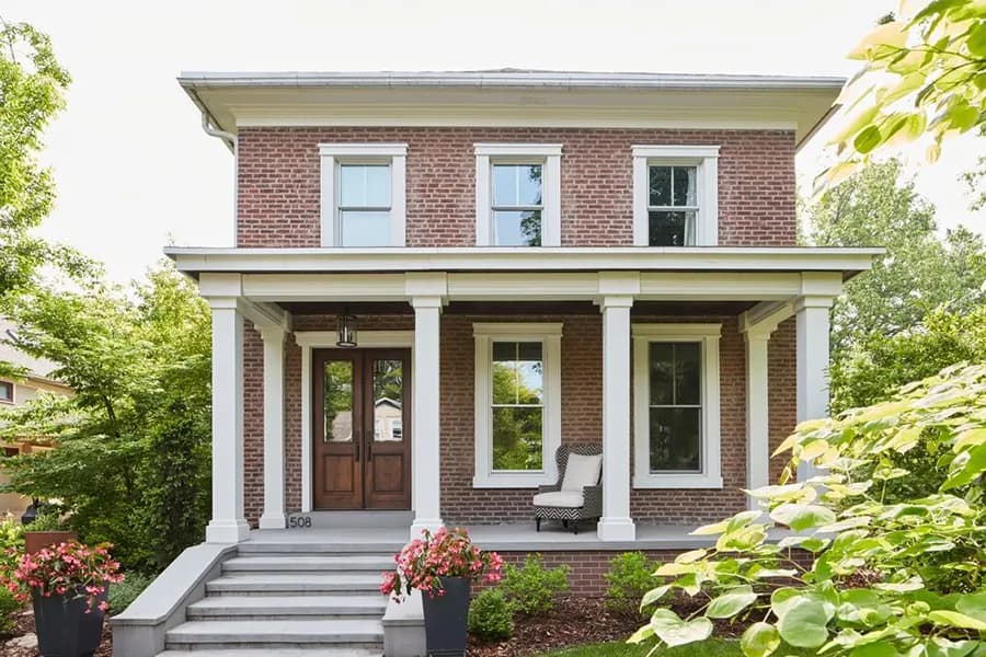 Pella traditional wood double entry doors anchoring a home's curb appeal