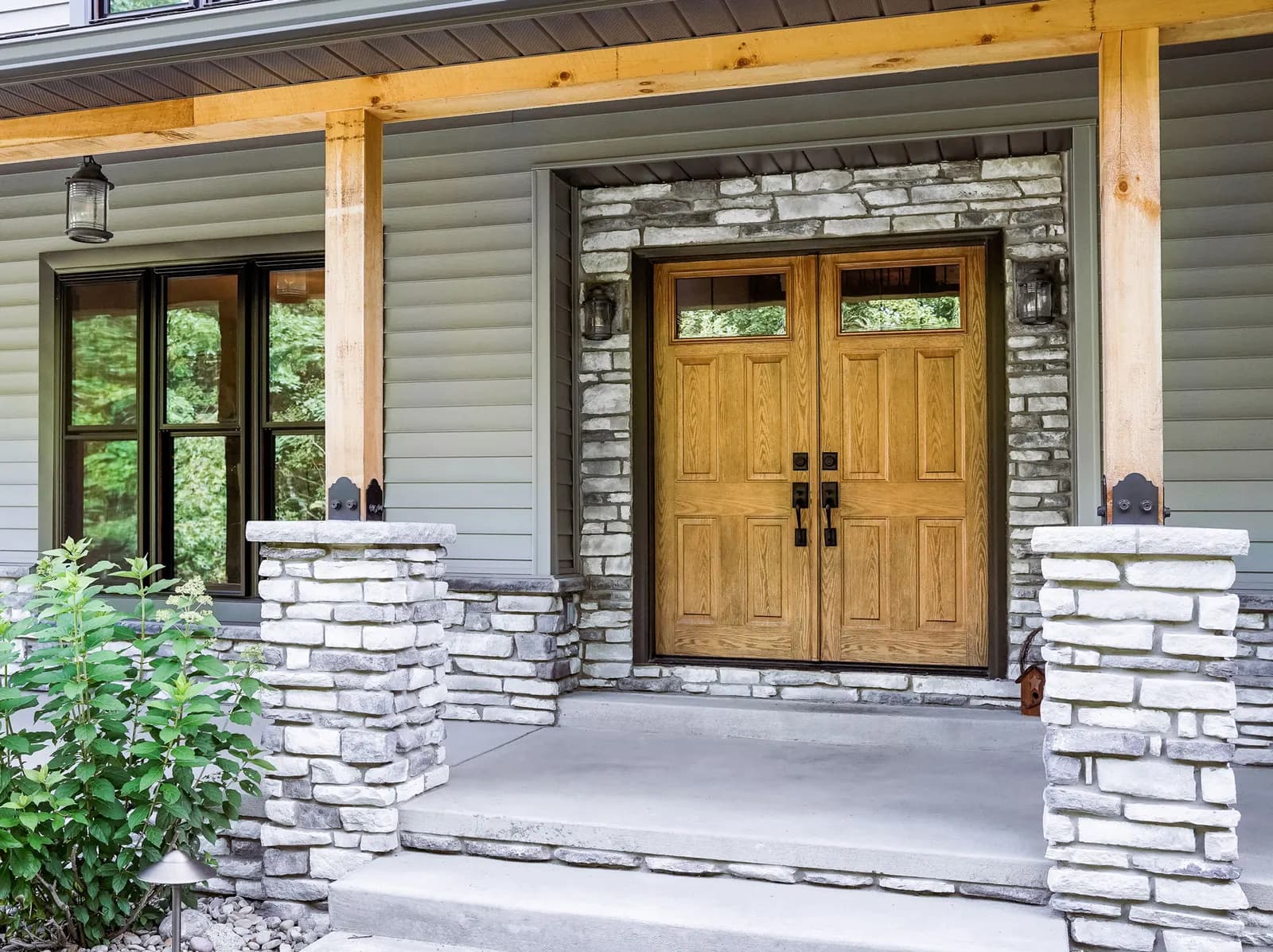 A wood ProVia entry door on a residential front elevation
