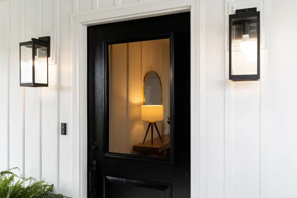 A brown ProVia entry door with a glass lite on a home's front entrance