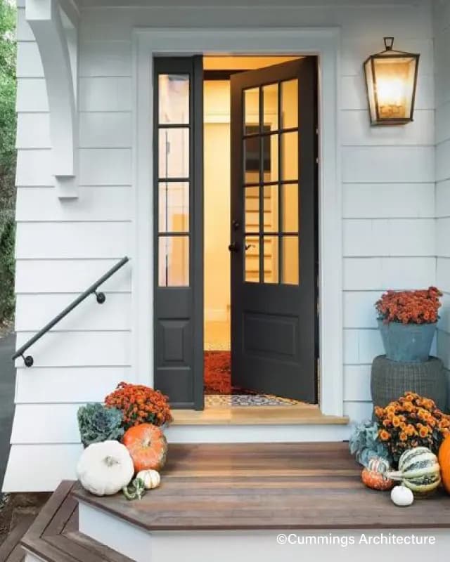 A wood Simpson entry door on a residential front elevation