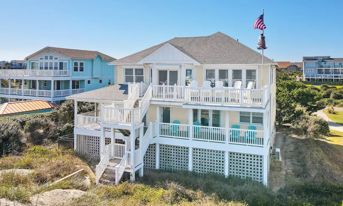 A coastal beach house on pilings with stacked porches clad in LP SmartSide siding