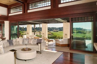Andersen multi-slide glass wall framing an indoor-outdoor living space