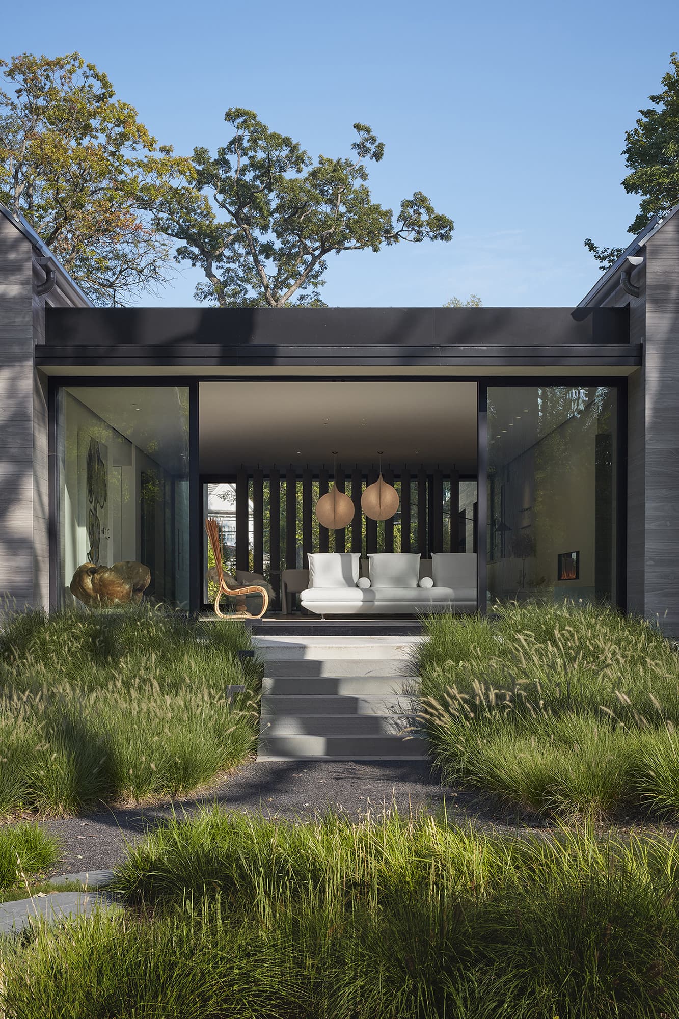LaCantina opening glass wall connecting the interior to an outdoor living area