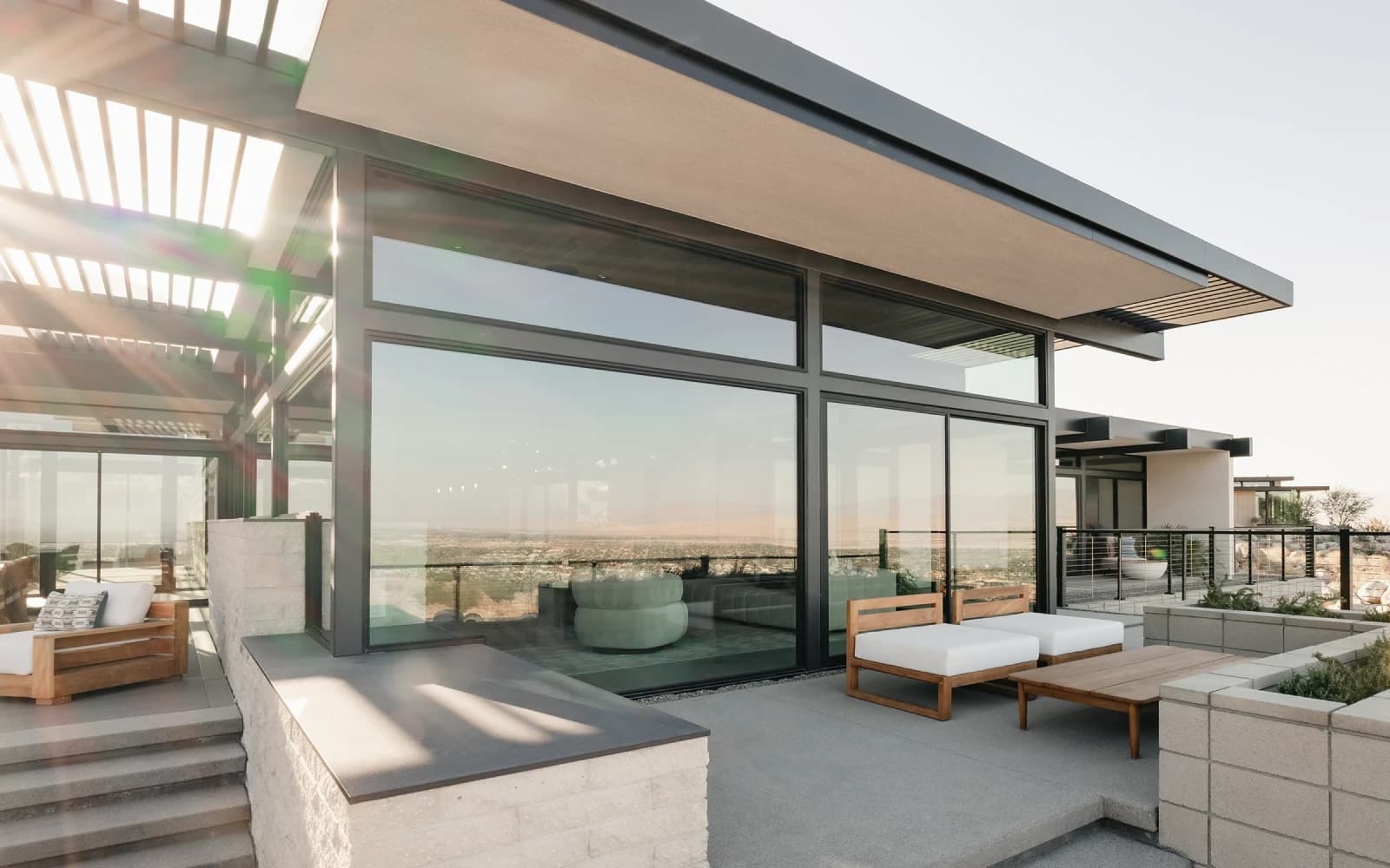 Western multi-slide glass wall connecting the interior to an outdoor living area