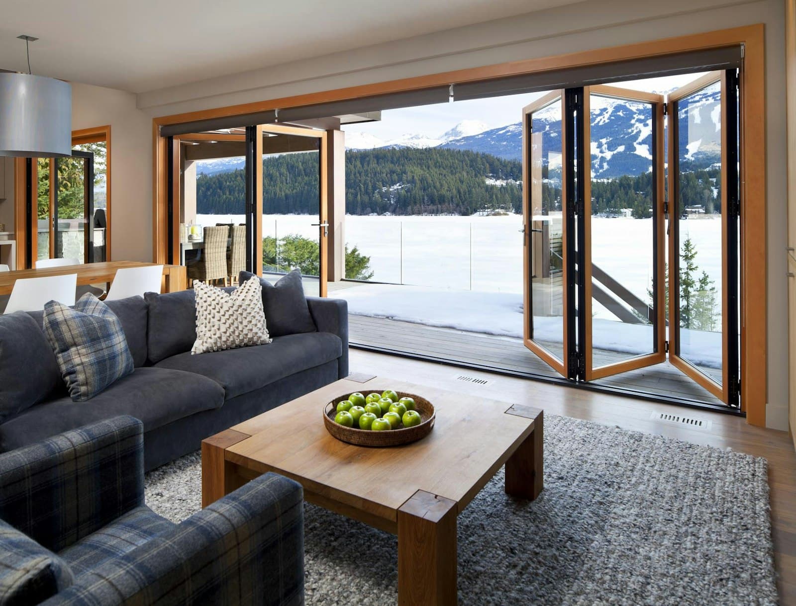 NanaWall bi-fold (accordion) glass door connecting the interior to an outdoor living area